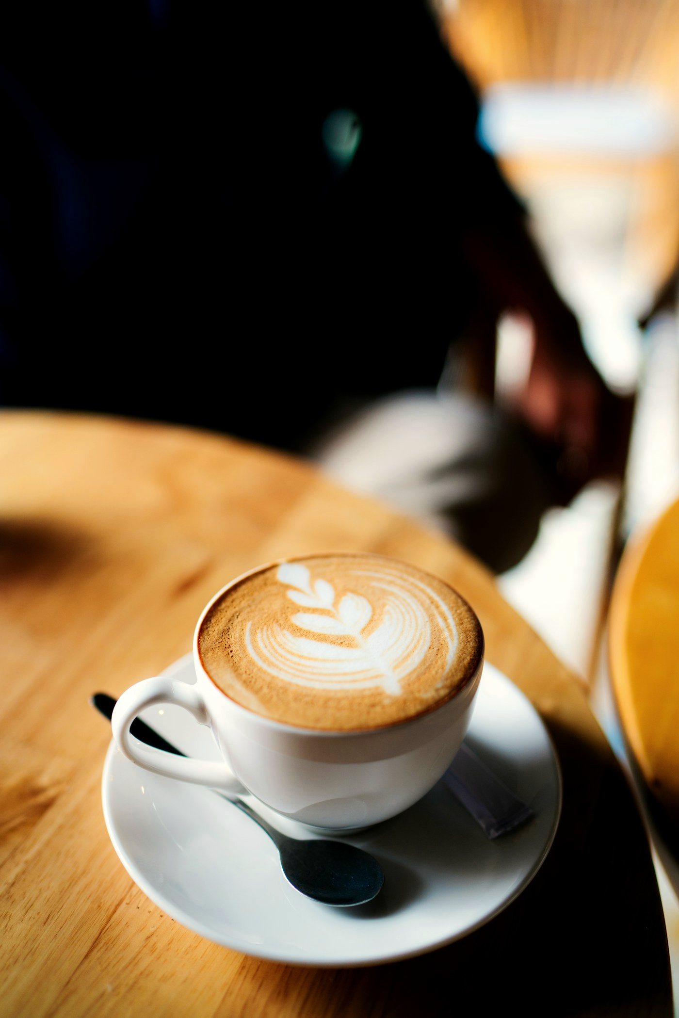 Espresso cup with golden crema in warm light