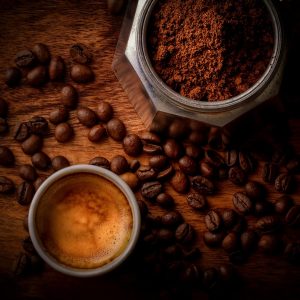 Huila Pink Bourbon roast with grounds and a cup of espresso
